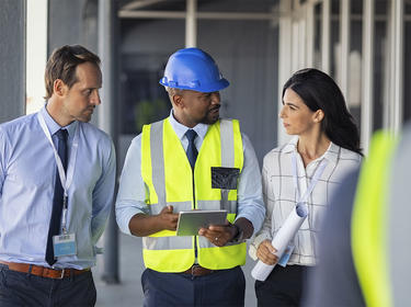 A team member walks visitors through a distribution center A team member walks visitors through a distribution center