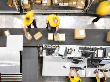 Processing and sorting packages inside a distribution center