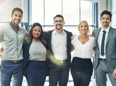 Five people posing for a photo