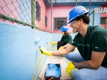 Prologis employees volunteering painting school IMPACT Day