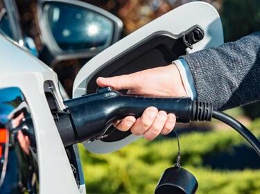 Workplace charging car charger hand with plug