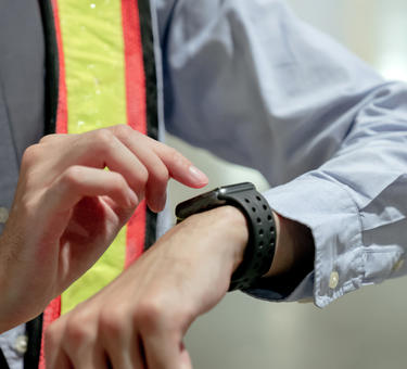 A person looking at a smartwatch 